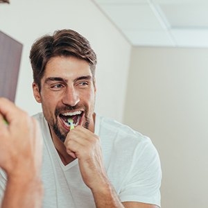 a man brushing his teeth