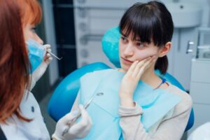 Woman at her emergency dental visit